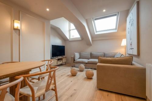 a living room with a couch and a table at Luxury Quayside Loft Sleeps 6 in Newcastle upon Tyne