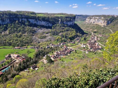 a small village in a valley with a cliff at Gîte des trois petits oiseaux in Picarreau