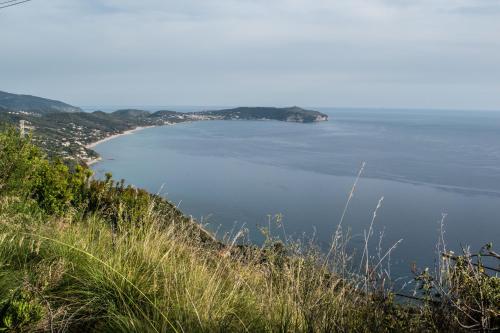 a view of the ocean from a hill at Il Malazzeno, Monolocale in Pisciotta