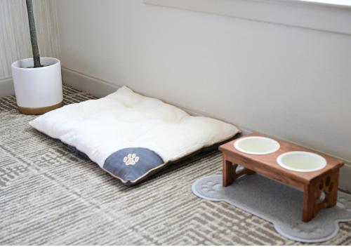 a bed sitting on the floor next to a table at Spring Mill Inn in Mitchell