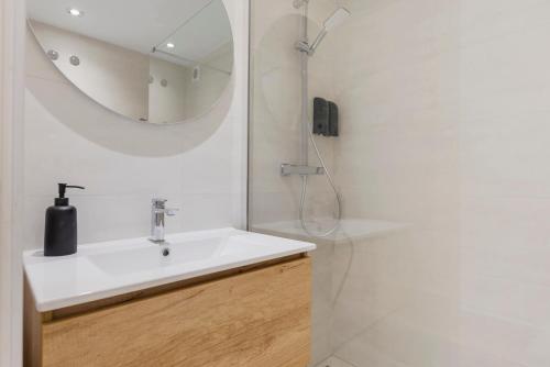 a white bathroom with a sink and a mirror at Casa Gabriel La Cala de Mijas in La Cala de Mijas