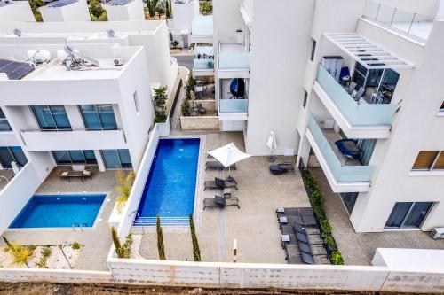 an aerial view of a building with a swimming pool at Anchora in Paralimni