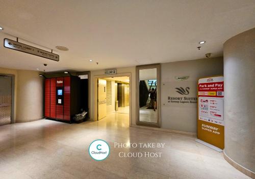 a hallway of a building with a glass door at Sunway Studio HomeStay Access Mall & next to Lagoon by Cloud Host in Petaling Jaya