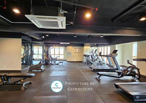 a gym with treadmills and ellipticals in a building at Sunway Studio HomeStay Access Mall & next to Lagoon by Cloud Host in Petaling Jaya
