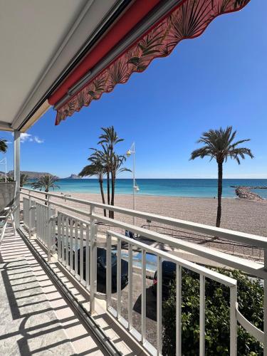 a view of the beach from the balcony of a house at Altea Beach Apartment in Altea