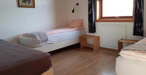 Postel nebo postele na pokoji v ubytování Guesthouse Myrkholt II