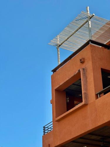 a building with a metal railing on top of it at Las Tortugas beach front condo in Khao Tao