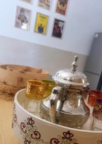 a glass container sitting on top of a table at Villa Dar Mira - Ghazoua Essaouira in Ghazoua
