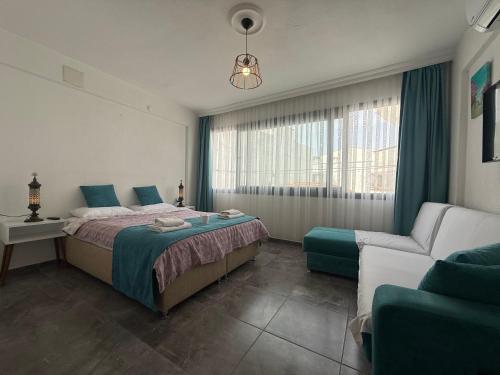 Ένα ή περισσότερα κρεβάτια σε δωμάτιο στο Arslan Homes 1