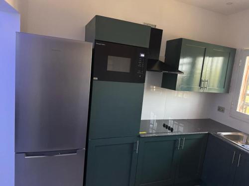 Η κουζίνα ή μικρή κουζίνα στο The View Apartments Salagi