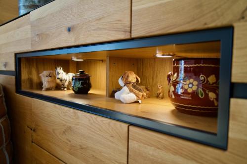 a shelf with stuffed animals sitting on it at Chalet zur Höhe in Grindelwald