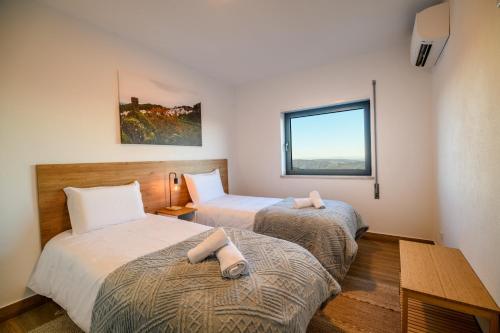 Postel nebo postele na pokoji v ubytování Casa do Beco - Seia, Serra da Estrela