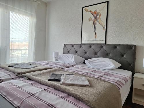 Llit o llits en una habitació de Apartment MG