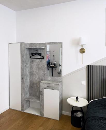 a bedroom with a bed and a table in a room at CASA IVH BNB in Florence