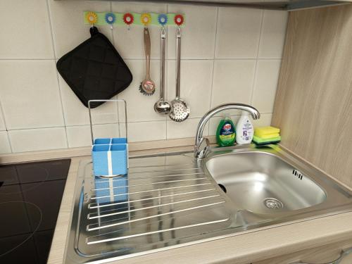 a kitchen counter with a sink in a kitchen at La Primula Roma, a 15 minuti da San Pietro in Rome