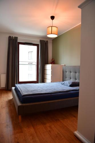 En eller flere senge i et værelse på Old Town Jaglana