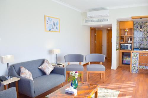 a living room with a couch and a table at Basma Executive Club in Aswan