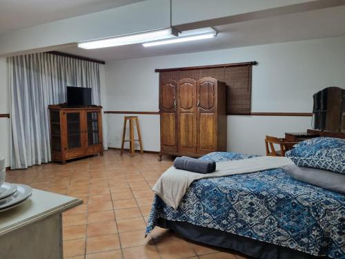 Ένα ή περισσότερα κρεβάτια σε δωμάτιο στο Kudu Crescent Guesthouse