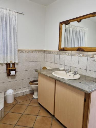 Ένα μπάνιο στο Kudu Crescent Guesthouse
