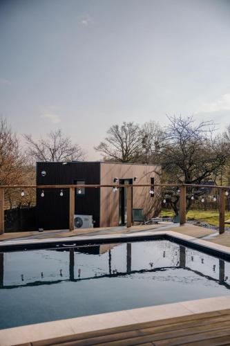 a swimming pool with a fence around it at Chez Lilie in Le Sel