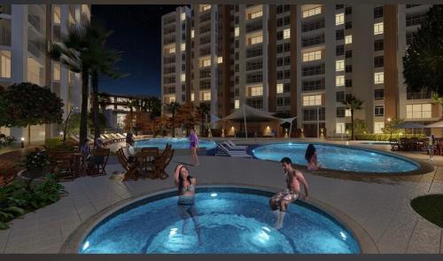 a group of people in a swimming pool in a building at Ciudad Cristales in Villeta