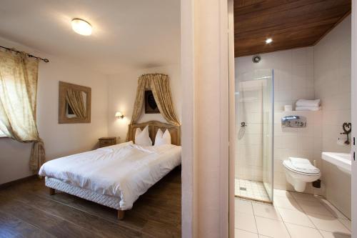 Säng eller sängar i ett rum på Le Domaine de Rouffach