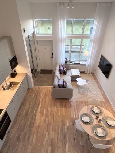 TV a/nebo společenská místnost v ubytování Lomma Harbour Apartment