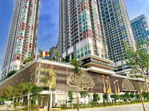 a building with tall skyscrapers in a city at i-Duplex 1M2R2B Condo - LED Garden, Fun Fair, Waterpark, Wax Museum, Mall & More! in Shah Alam