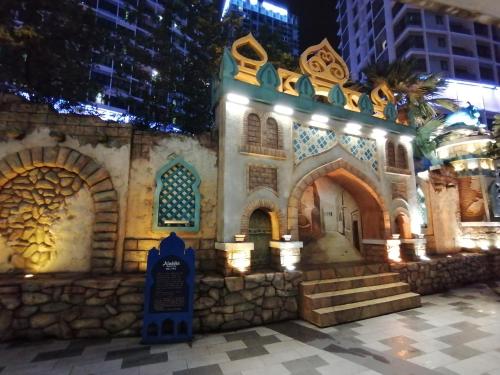a building that is lit up at night at i-Duplex 1M2R2B Condo - LED Garden, Fun Fair, Waterpark, Wax Museum, Mall & More! in Shah Alam
