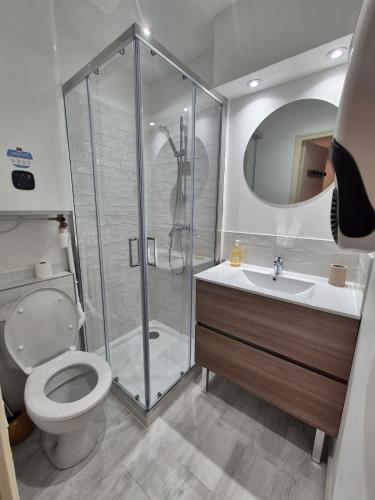 a bathroom with a shower and a toilet and a sink at Casa Paloma - Centre ville Arles in Arles