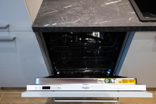 an oven with a black counter top on top at Apartments and holidays Cav Chiara Tione di Trento in Tione di Trento
