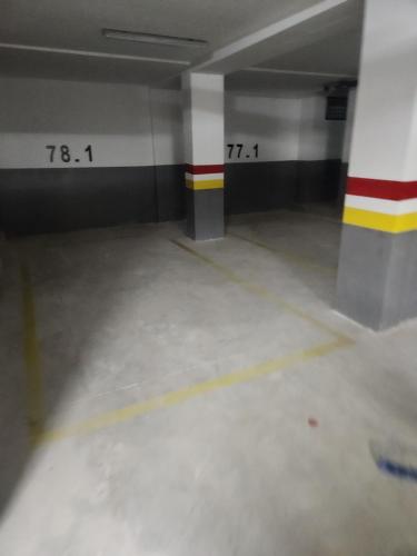 an empty room with two numbers on the walls of a building at Beautiful Prestigia apartment near the beach "Plage Des Nations" Sale Rabat in Sidi Bouqnadel
