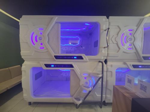 an open refrigerator with purple lights on it at DOZ Lounge in Krishnagiri