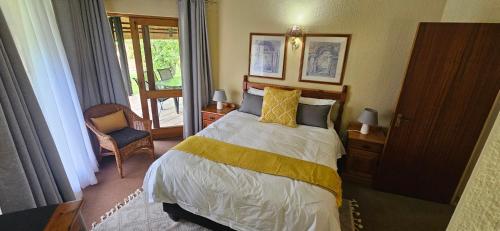 Ένα ή περισσότερα κρεβάτια σε δωμάτιο στο Kruger park lodge 503