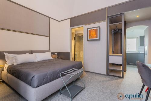 a bedroom with a bed and a walk in closet at Palazzo Piccinni 97 by Apulia Accommodation in Bari
