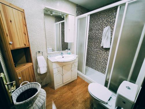 a bathroom with a sink and a toilet and a shower at Cayo Beach in Torrox Costa