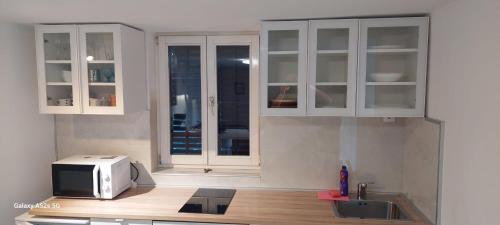 Kuchyň nebo kuchyňský kout v ubytování Apartman Tonko