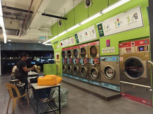 a store with several washing machines in a store at The Luxe Colony KLCC By AZHA in Kuala Lumpur