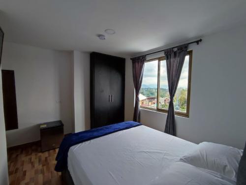 Postel nebo postele na pokoji v ubytování Apartahotel JDK