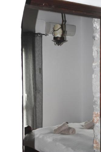 a mirror reflecting a bed with a teddy bear on it at Sea Sight Vibes in Frangokastello