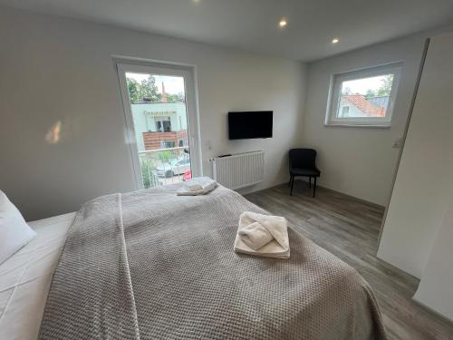 Postel nebo postele na pokoji v ubytování Exklusives Ferienhaus mit Sauna und Panorama Dachterrasse, traumhafter Ausblick garantiert