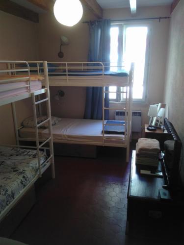 a bedroom with two bunk beds and a window at Crew Lighthouse in Antibes