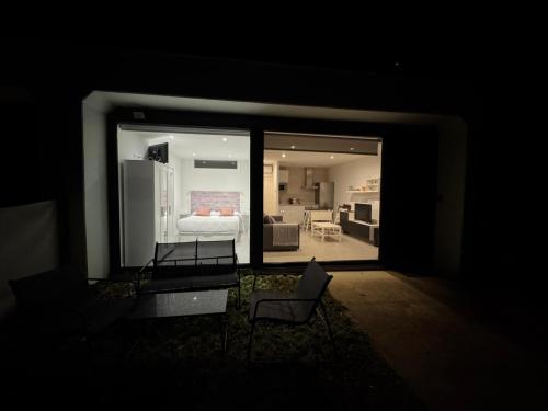 a dark room with a view of a living room at Apartamentos EL SERRÓN Colombres in Colombres