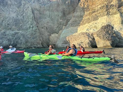 a group of people in kayaks in the water at Kleo's Guesthouse in Éxo Goniá