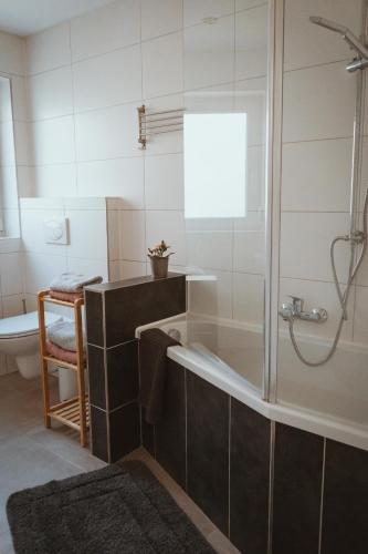 a bathroom with a shower and a bath tub at Little Break in Röfingen