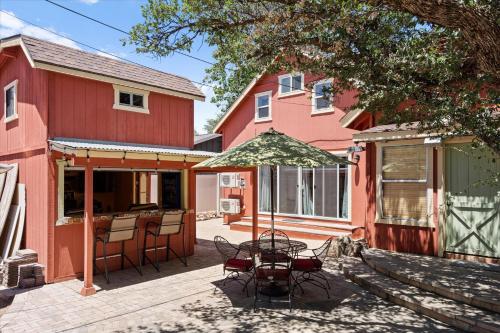 a patio with a table and chairs in front of a house at Timberland Hideaway in Payson