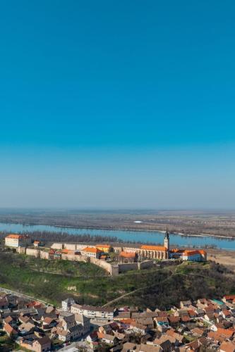 an aerial view of a town next to a body of water at Bogdanović Winery Apartman in Ilok