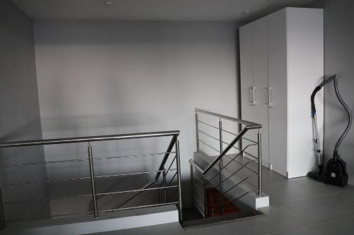 a glass shelf in a room with a wall at Ocean Bliss Penthouse - Private Pool & 2 Min to Beach in Flic-en-Flac