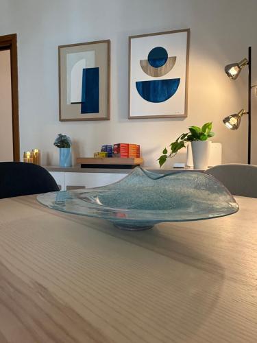 a glass bowl sitting on top of a table at Robert HoME Deluxe Apartment Turin in Turin