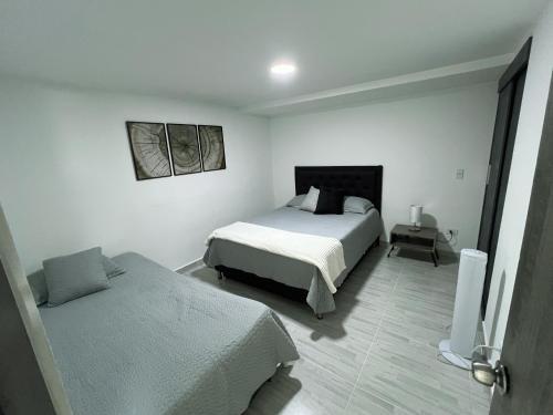Postel nebo postele na pokoji v ubytování Comodo y amplio apartamento en Laureles